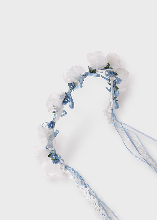 Flower headband in sky blue, standing.