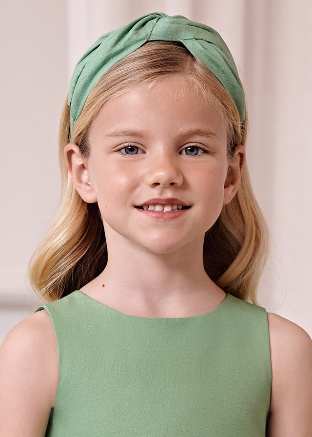 Girl Wearing Intertwined Headband, Apple